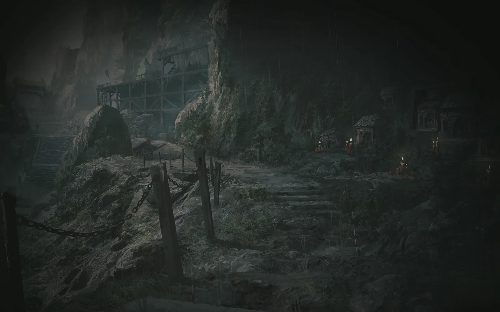 The mountain road of the Mountain of Imprisonment, wooden fencing running along the rock face, the lights of dwellings in the distance