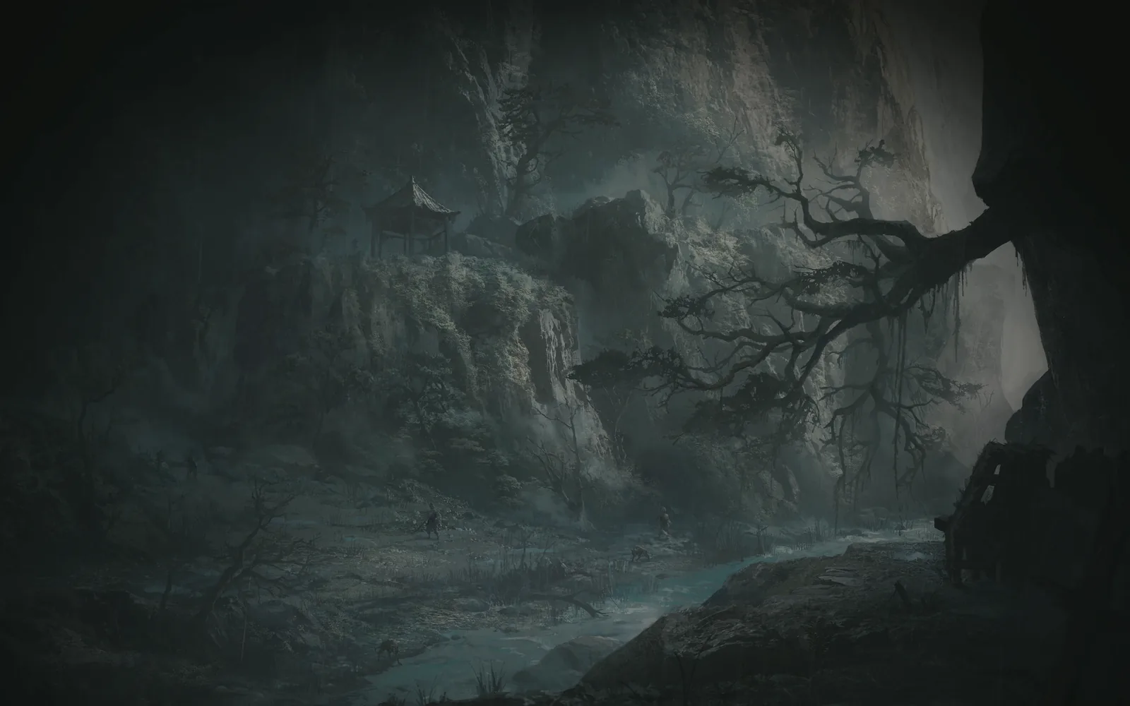 Cliffs, dead trees and the water running along the floor of the valley